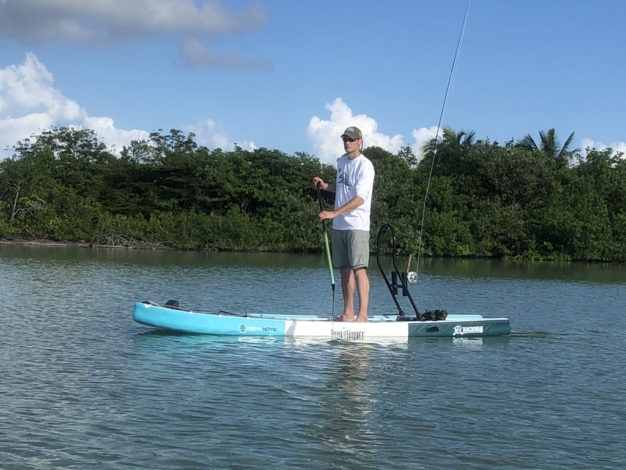 Hemispheres Unlimited owner Justin Witt scanning the mangroves at Ambergris Caye in Belize